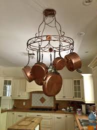 CRÉMAILLÈRE ET CHAUDRONS EN CUIVRE D'ALSACE