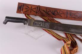 Sold at Auction: A machete in a leather sheath, South America. 20th century.