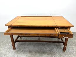 Sold at Auction: INDUSTRIAL ARTIST'S ARCHITECT'S DRAFTING TABLE. ADJUSTABLE TOP ABOVE TWO DRAWERS.