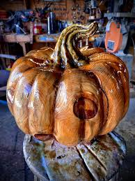 Chainsaw carved pumpkin from pine wood