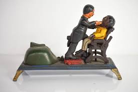Sold at Auction: Black Man Getting Tooth Pulled Cast Iron Bank