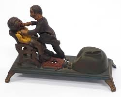 Sold at Auction: Dentist cast iron mechanical bank