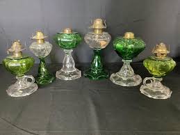 Lot - Six Green and Clear Glass Oil Lamps