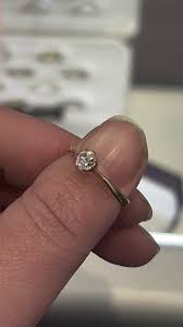 Can anyone tell me anything about this diamond ring? It's a natural, old mine cut diamond in 18k gold but I don't know the, size, clarity, era etc. Any info would be