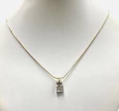 14kt Yellow Gold Chain With a 0.60ctw Diamond and 18kt White ...