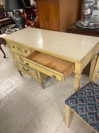 Remarkable French provencial 4 drawer vintage Dixie desk with blue highlights, measures 46 1/2” wide x 29” deep x 30” high. With matching chairs both PCs for $100.00. - [ ] Can