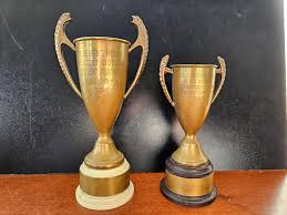 Sold at Auction: 2 1950s Newport High School Trophies LOT 7