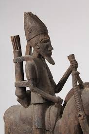 Lot - (2) MONUMENTAL AFRICAN SCULPTURES - Two Dogon Warrior Equestrian Guards, Mali, in carved wood, 20th c, 66" x 29" x 8" & 61" x 29" x 9"