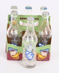 Sold at Auction: DONALD DUCK LINE COLA 6-PACK & BOOK