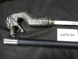 Sold at Auction: Dragon head cane sword, cane is 36", sword is 20"
