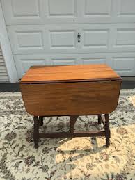 Spindle leg drop leaf table | EstateSales.org