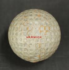 A Warwick square mesh and dot golf ball