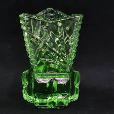 Sold at Auction: Four pieces of Depression Glass or Green Glass, including, two jugs and two vases