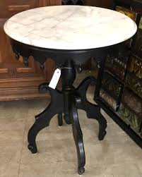 Lot - Victorian style circular side table, painted black ...