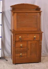 Eastlake style walnut 2 part slant-front secretary; 16264-022 - R.H. Lee & Co. Auctioneers