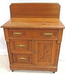 Eastlake Spoon Carved Butter Print Chestnut Wash Stand,