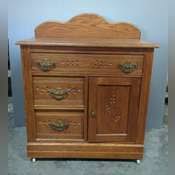 Antique 3 Drawer Washstand With Carved Drawer Fronts And Porcelain Caster Wheels, 36" x 14.5" x 29" - Mayo Auction & Realty