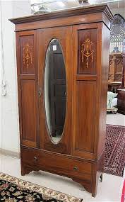 Lot - AN EDWARDIAN INLAID MAHOGANY WARDROBE, English, c.