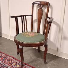 Sold at Auction: CORNER CHAIR - Antique American mahogany with tall back, yoke-style arms, round seat platform with needlepoint and petit-point uphol...