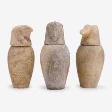 Three Egyptian limestone canopic jars After the Antique, 19th/20th century Lot 5
