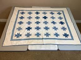 Lot - Floating star quilt. 84" x 65". Several tears.