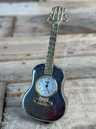 Sold at Auction: Elgin Mini Guitar Clock