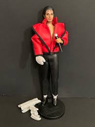 LOT 97DR: Vintage Michael Jackson Collection Including 80' Doll & Thriller Record | EstateSales.org