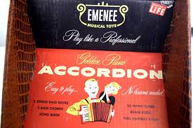 Sold at Auction: 1955 Emenee Musical Small Golden Piano Accordion And GE Youth Electronics Record Player General Electric Music Toy