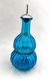 Sold at Auction: Three art glass barber bottles