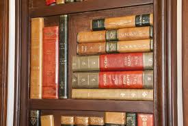 Sold at Auction: Tooled Leather Book Spines Three Panel Screen