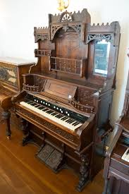 Lot - VICTORIAN WALNUT PARLOR PUMP ORGAN