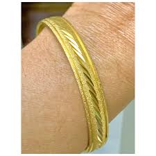 Vintage Crown Trifari Gold Tone Bangle Bracelet. For Sale at Ruby Lane