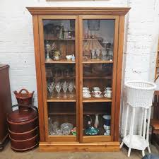 Sold at Auction: A Large Antique Pine Two-Door Display Cabinet