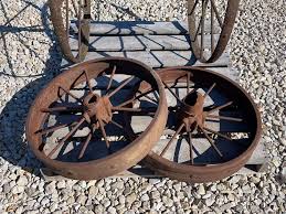 4 antique iron wheels - Schneider Auctioneers LLC