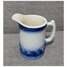 Blue and white stoneware pitcher attributed to Red Wing. For ...