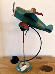 FLYING ACE SKY HOOK AIRPLANE METAL BALANCE FOLK ART TEETER TOY | eBay