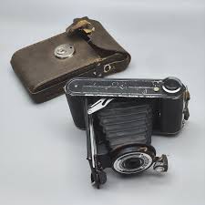 Sold at Auction: AN EARLY ACCORDION CAMERA MADE BY CORONET ENGLAND