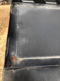 What are the small rust spots on my car doors and bed sides?