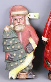Sold at Auction: (3) Santa Figures: (1) hand painted papier mâché' by Jennifer Motter, signed on back, 18” T; (1) tall Santa is bright red suit holding a stocking, 23” T & (1) resin, 16 ½” T
