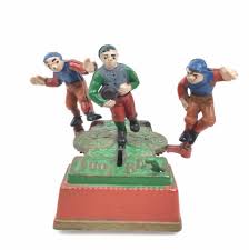 Sold at Auction: Vintage Cast Iron Football Coin Bank