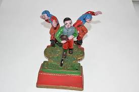 Vintage Cast Iron Mechanical Spring Loaded Hockey Coin