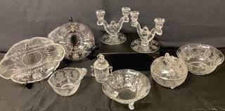 Lot - Heisey orchid etched pattern. Pair of candlestick holders, three candy dishes one with lid, one small serving tray, one relish tray, one serving bowl and one jelly jar.