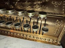 How to remove and replace key arms on a 323 cash register?