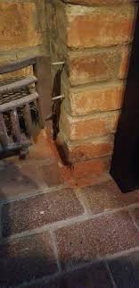 What could be causing the base brick to erode?