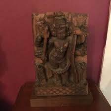 India carving. very good details. on a new wood fitted stand ...