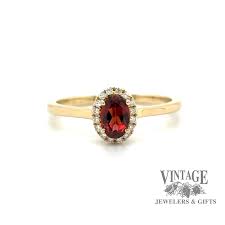 Oval garnet and diamond 14ky gold halo ring — Vintage Jewelers & Gifts, LLC.
