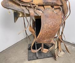 Sold at Auction: MONTANA COWBOY TOOLED LEATHER SADDLE