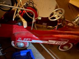 Metal fire truck pedal car no longer need used as a prop for ...