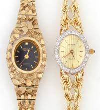 Sold at Auction: Two 14K Yellow Gold Lady's Geneve Quartz Wristwatches, one with nugget decoration and a black face; the second with