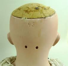 Sold at Auction: A K&K; 58 bisque head doll, made in Germany, cloth body, composite lower lim